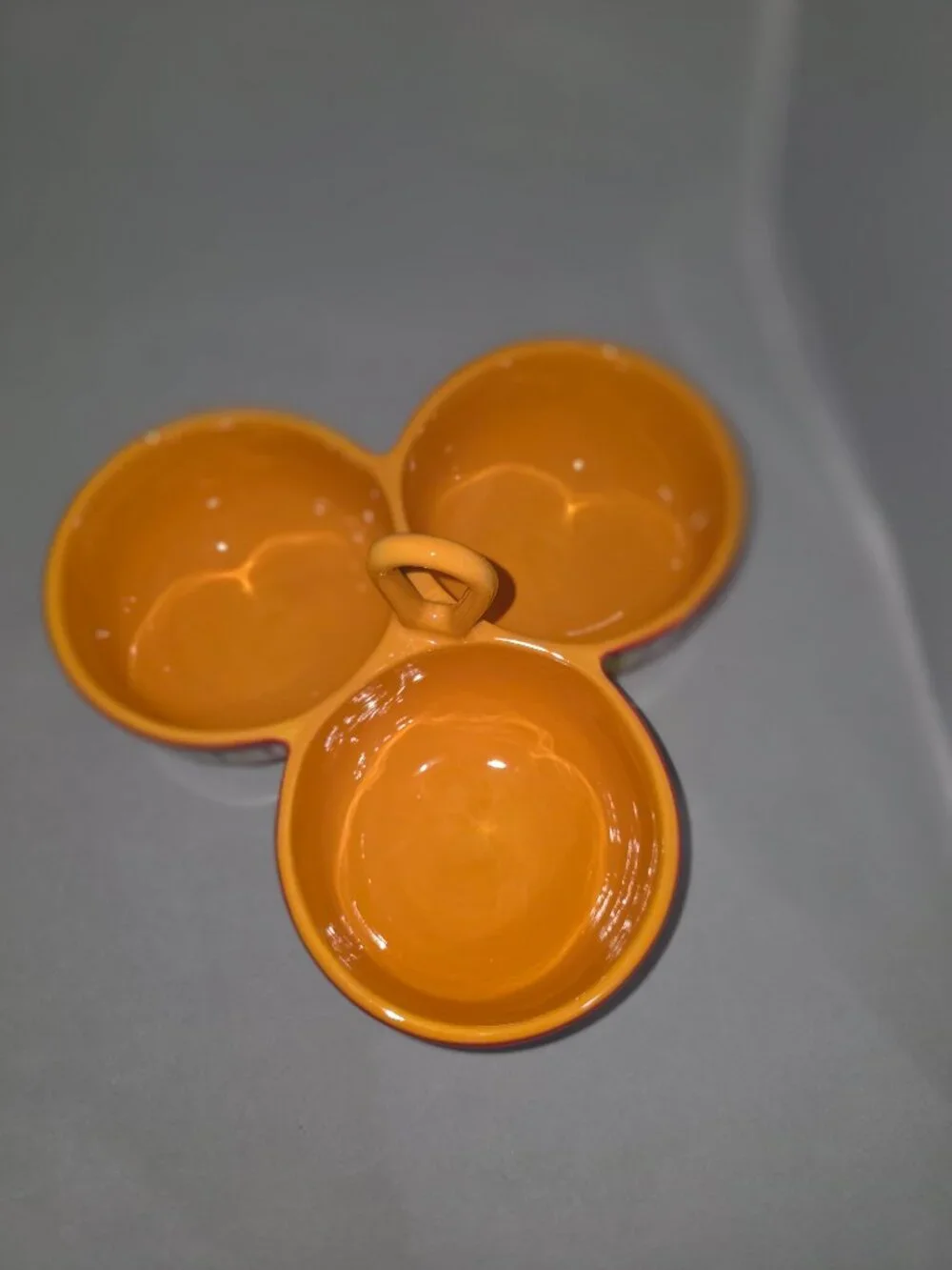 A Crate & Barrel Mambo Margarita triple-bowl ceramic dip server.